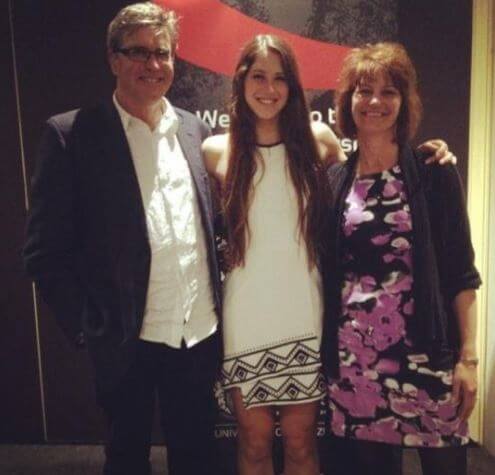 Eliza McCartney with her parents.